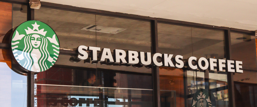 Starbucks coffee store with the iconic mermaid logo above the entrance.
