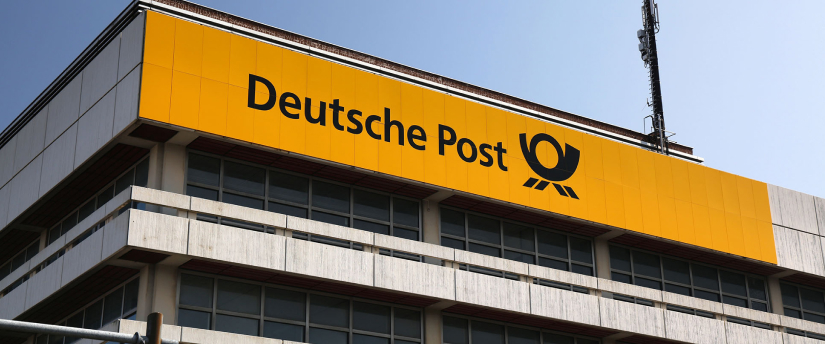 An exterior view of a building featuring a large "Deutsche Post" sign, representing the well-known postal service.
