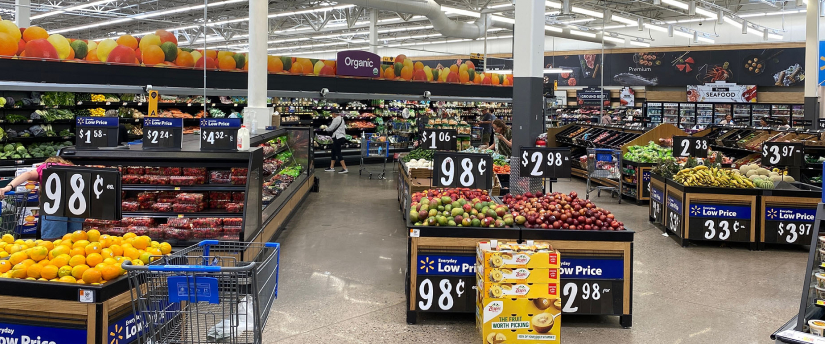 An expansive grocery store filled with an abundant selection of colorful fruits and vegetables for shoppers to choose from.