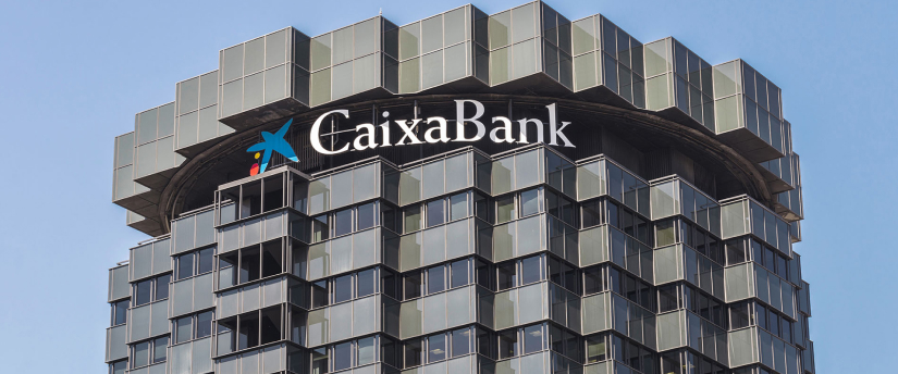 A skyscraper displaying a large sign that states "Gakka Bank," highlighting its contemporary design and urban setting.