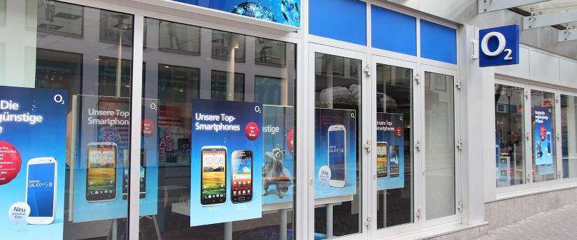 A retail establishment characterized by multiple expansive windows, allowing a glimpse of the merchandise within.