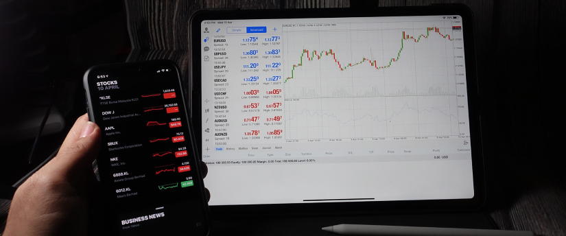 An iPhone displaying a stock market app interface, illustrating tools for forex trading and market analysis.