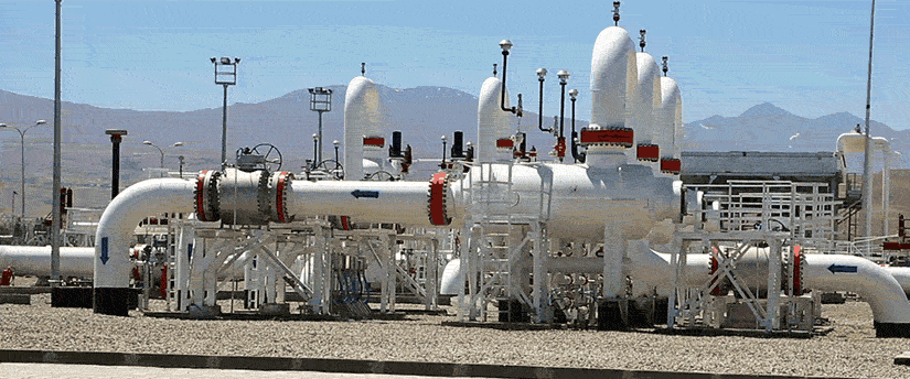 Pipelines and valves in an oil field, showcasing infrastructure essential for energy production and management.