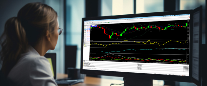 A woman engaged in trading reviews a computer screen showing a detailed chart, highlighting key indicators and analysis