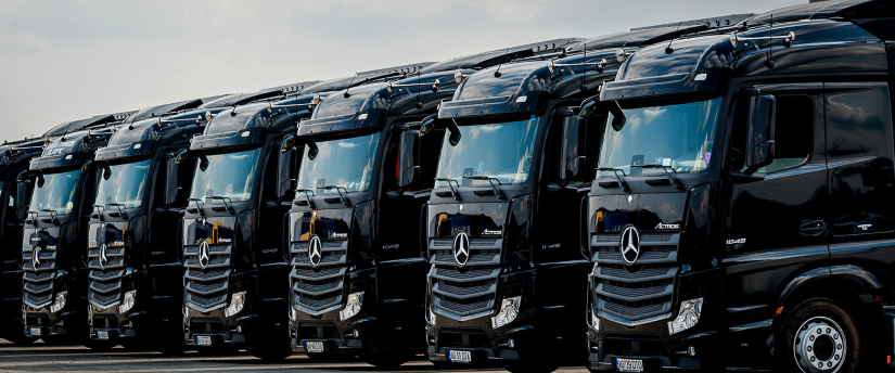 Mercedes-Benz truck featuring the iconic three-pointed star logo on the front grille, designed for durability and efficiency.