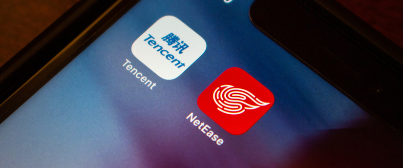 Close-up of an iPhone featuring the NetEase app icon, showcasing the app's branding and interface.