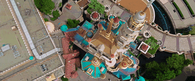 Image of the Walt Disney Castle, with its iconic spires and fairy-tale architecture, set against a bright, magical sky.