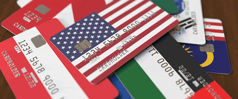 redit cards adorned with the flags of America, Europe, and Asia, representing international financial connections.