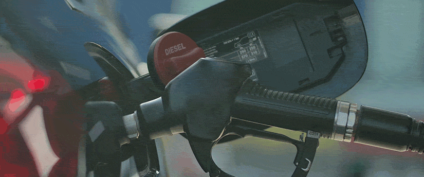 Close-up of a gas pump featuring a prominent red light, highlighting its operational status and attention-grabbing design.