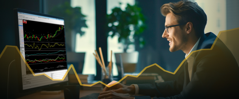 A man in a suit examines a computer screen displaying a chart, indicating a focus on data analysis.