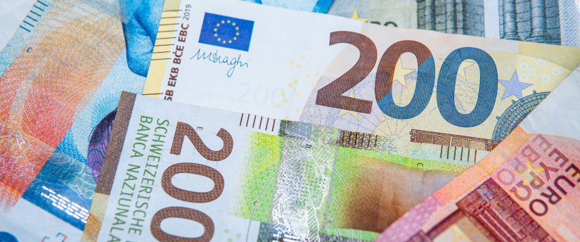 A collection of euros banknotes displayed, showcasing various denominations and colors.