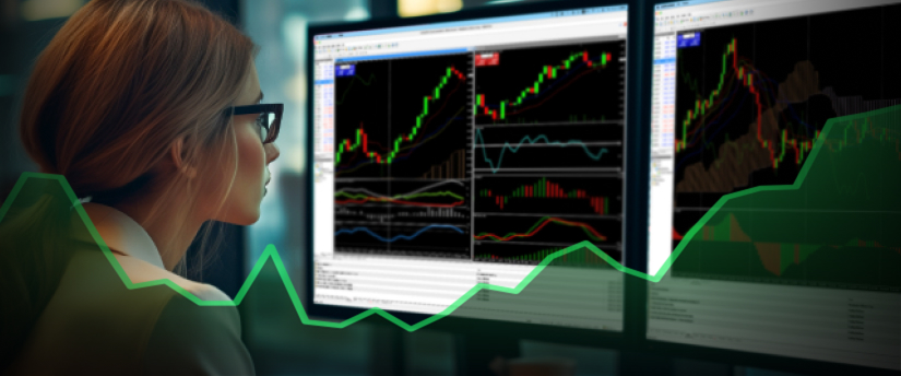 A woman gazes intently at a screen displaying a colorful graph, analyzing data with a focused expression.