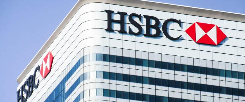 HSBC bank building with prominent logo, showcasing a modern corporate headquarters.