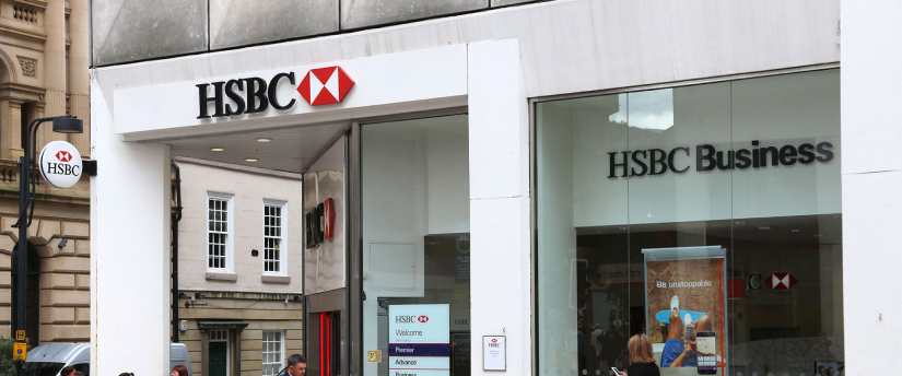 HSBC bank storefront with branding visible, representing a modern financial institution.