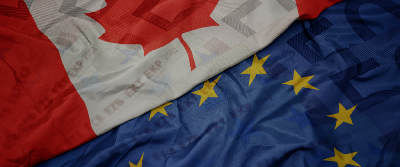 Canada and European Union flags displayed together, symbolizing international cooperation and partnership.