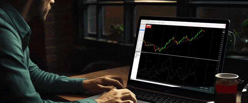 A man engaged in forex trading on his laptop, surrounded by financial charts and data.
