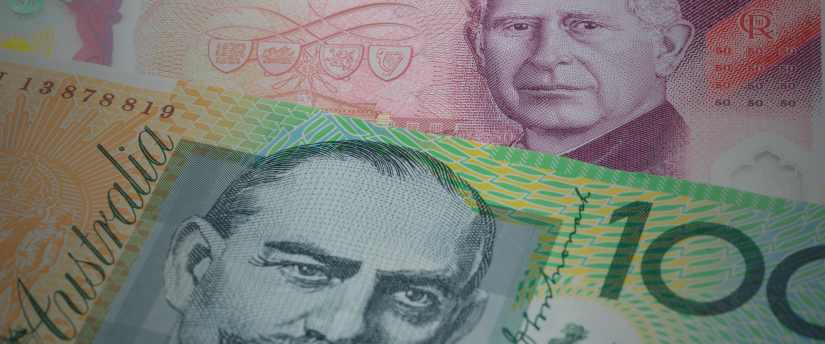 Image of Australian dollar notes alongside multiple US dollar bills, illustrating currency comparison.
