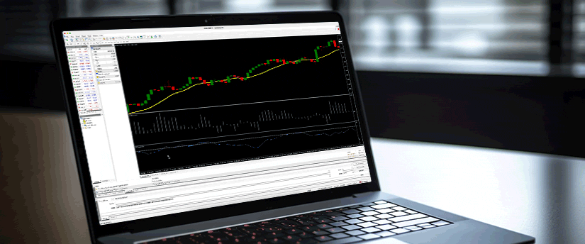 A laptop displaying a trading chart on its screen, illustrating market trends and data analysis.