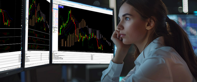 Trader reviewing charts and following a structured plan to build trading discipline in the financial markets